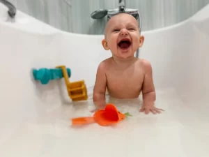 Playing in the bath with the baby