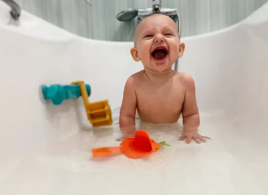 Playing in the bath with the baby